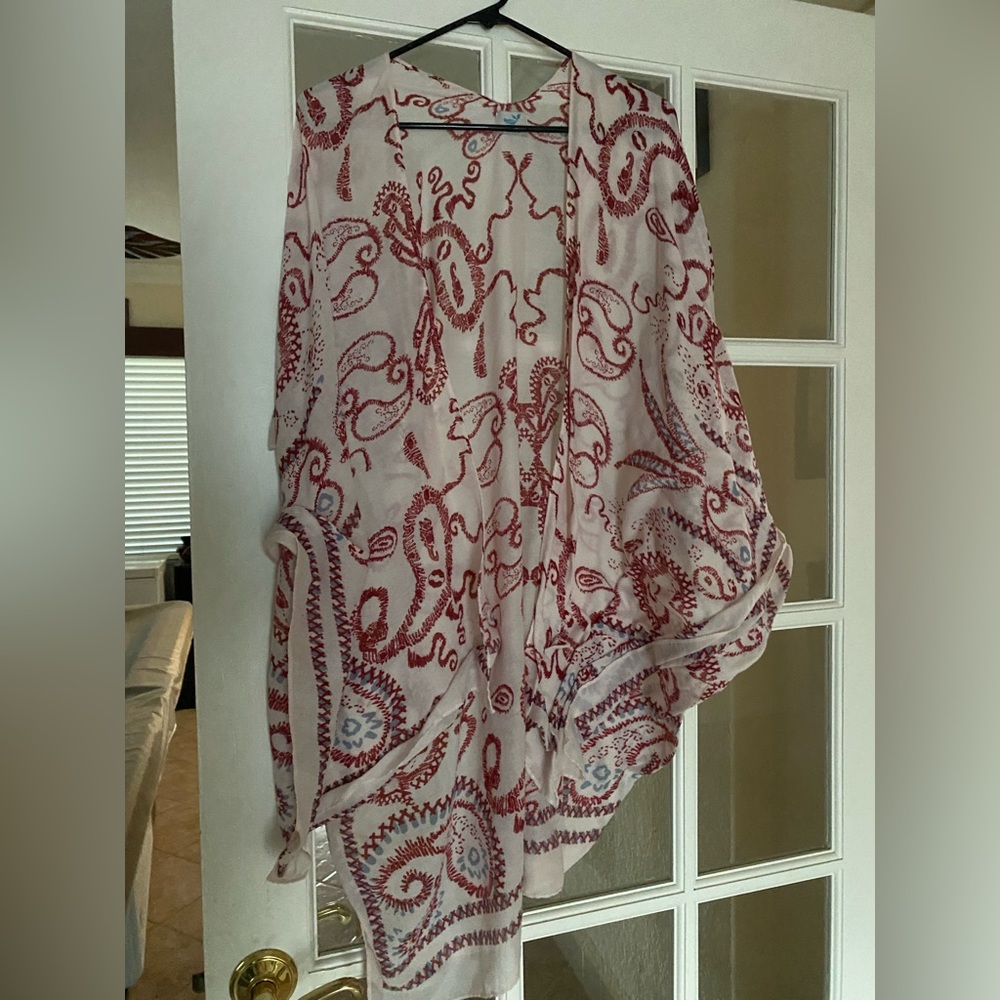 Beach coverup by Save the Ocean in an abstract red and blue print on white.